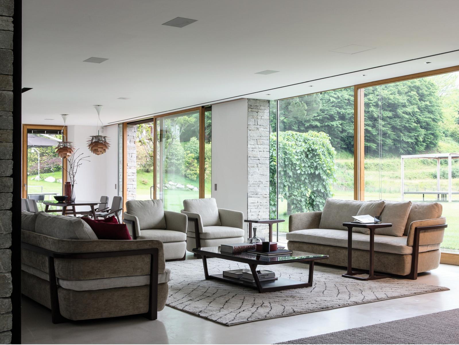 Upholstered fabric armchair with armrests | Arena by Porada