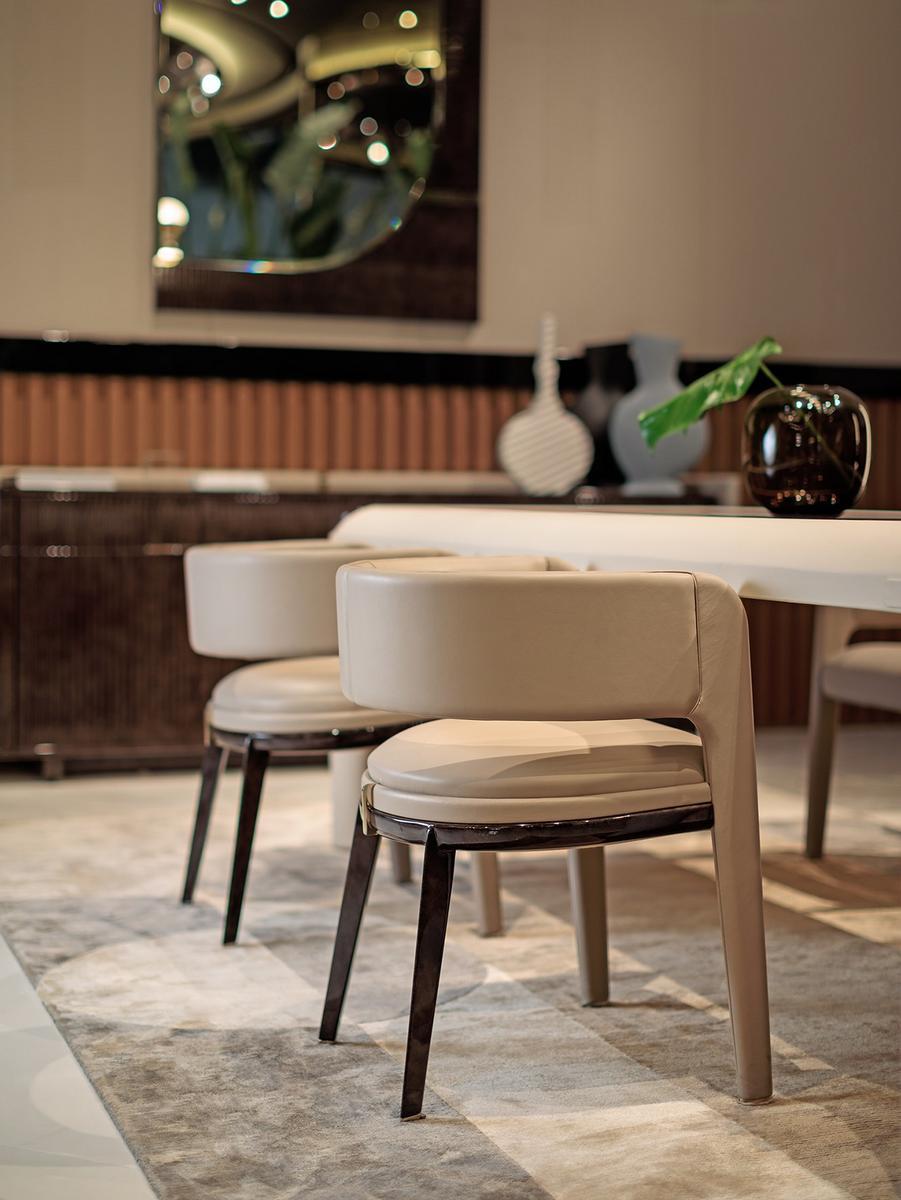 Leather easy chair with armrests | Eclipse by Turri